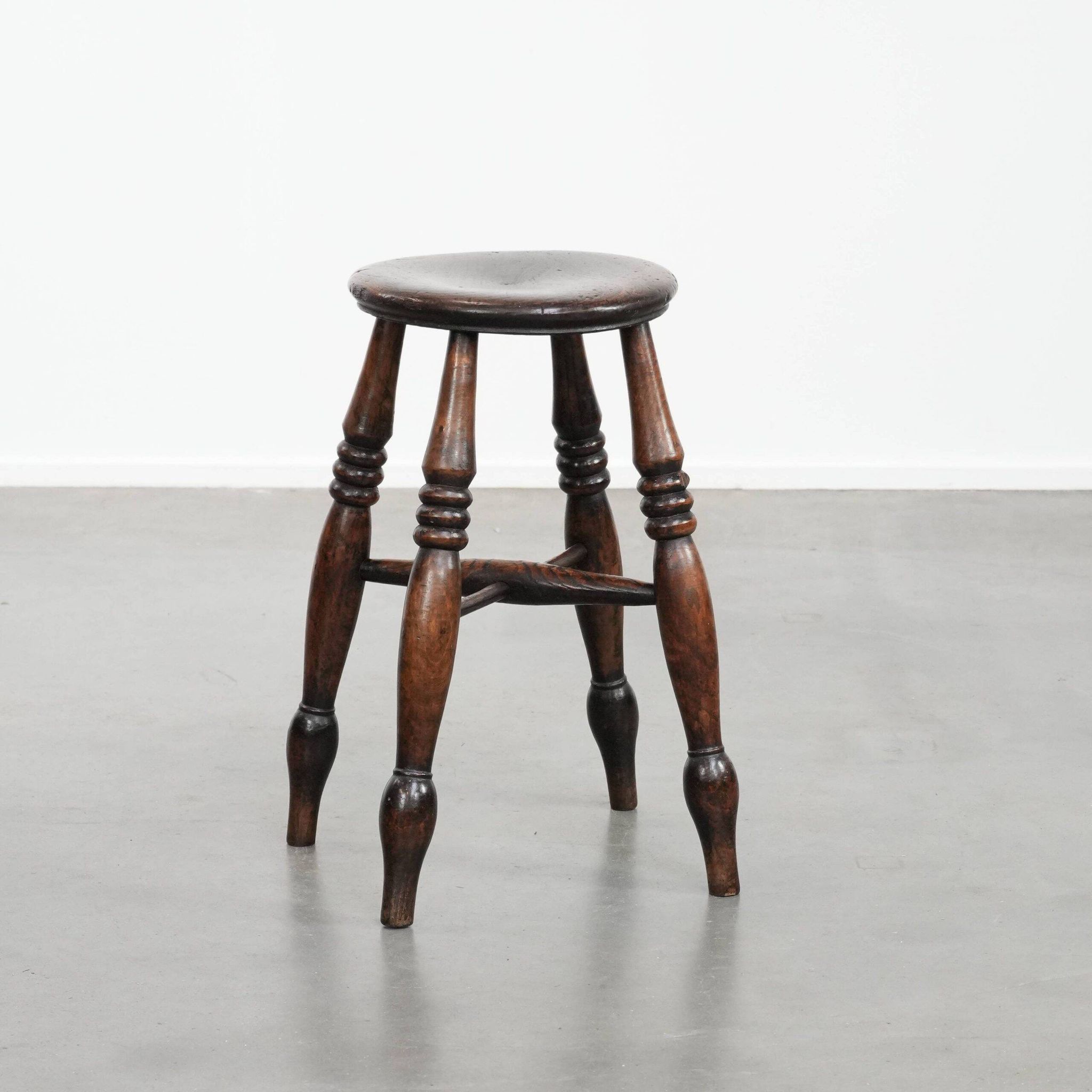 Antique English Windsor stool from the 18th century with a great patina