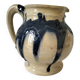 handcrafted ceramic jug with navy blue drip glaze.