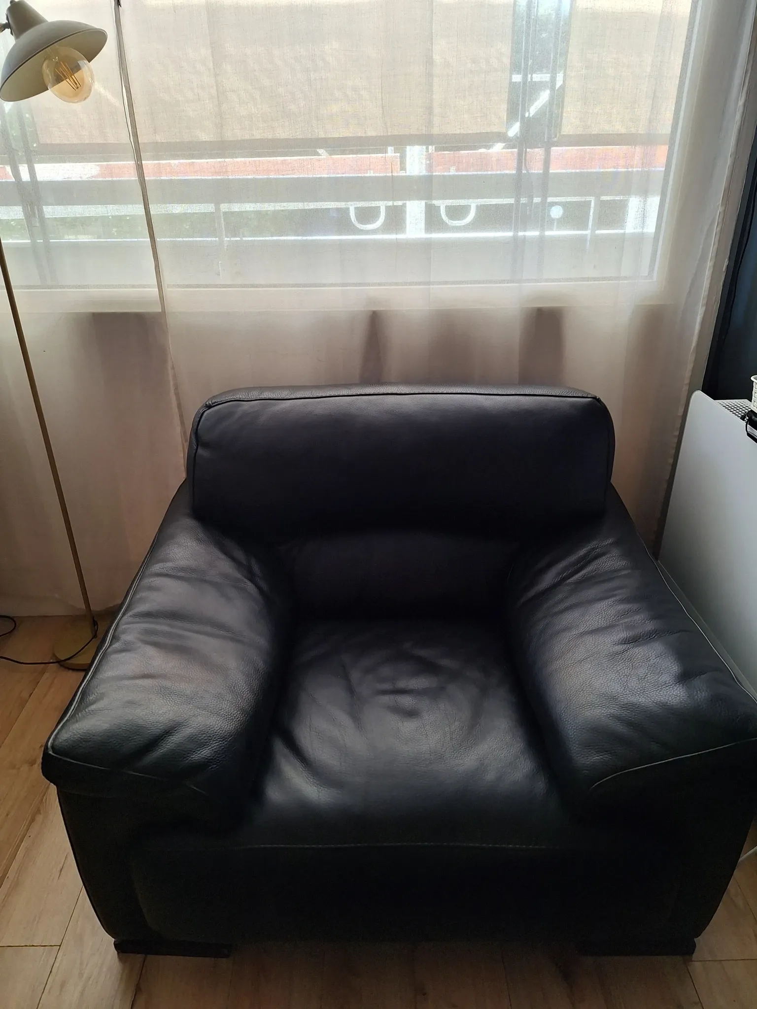 Black leather armchair Roche Bobois
