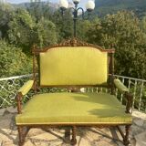 Richly carved solid wood bench in Louis XVI style.