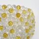 Pair of vintage wall lights with yellow and transparent beads. 70s