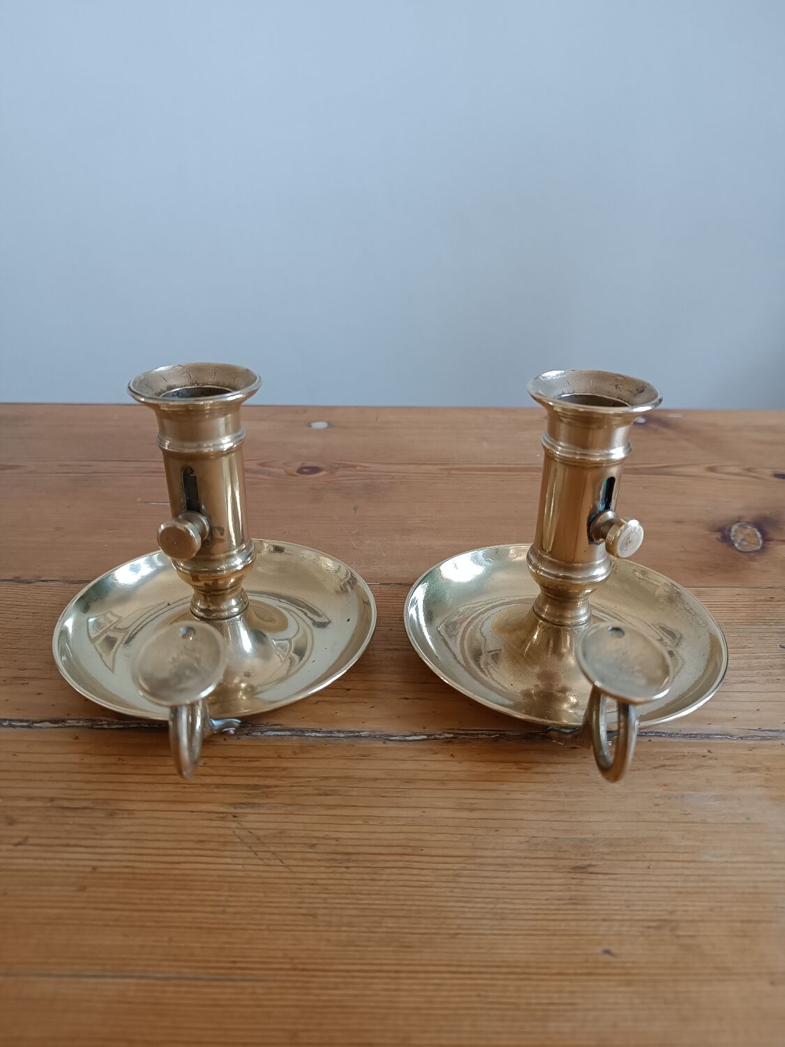Duo of gilded brass cellar rat candlesticks