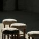 A hexagonal oak stool, seat refurbished in lambswool, Danish design from the 1950s.