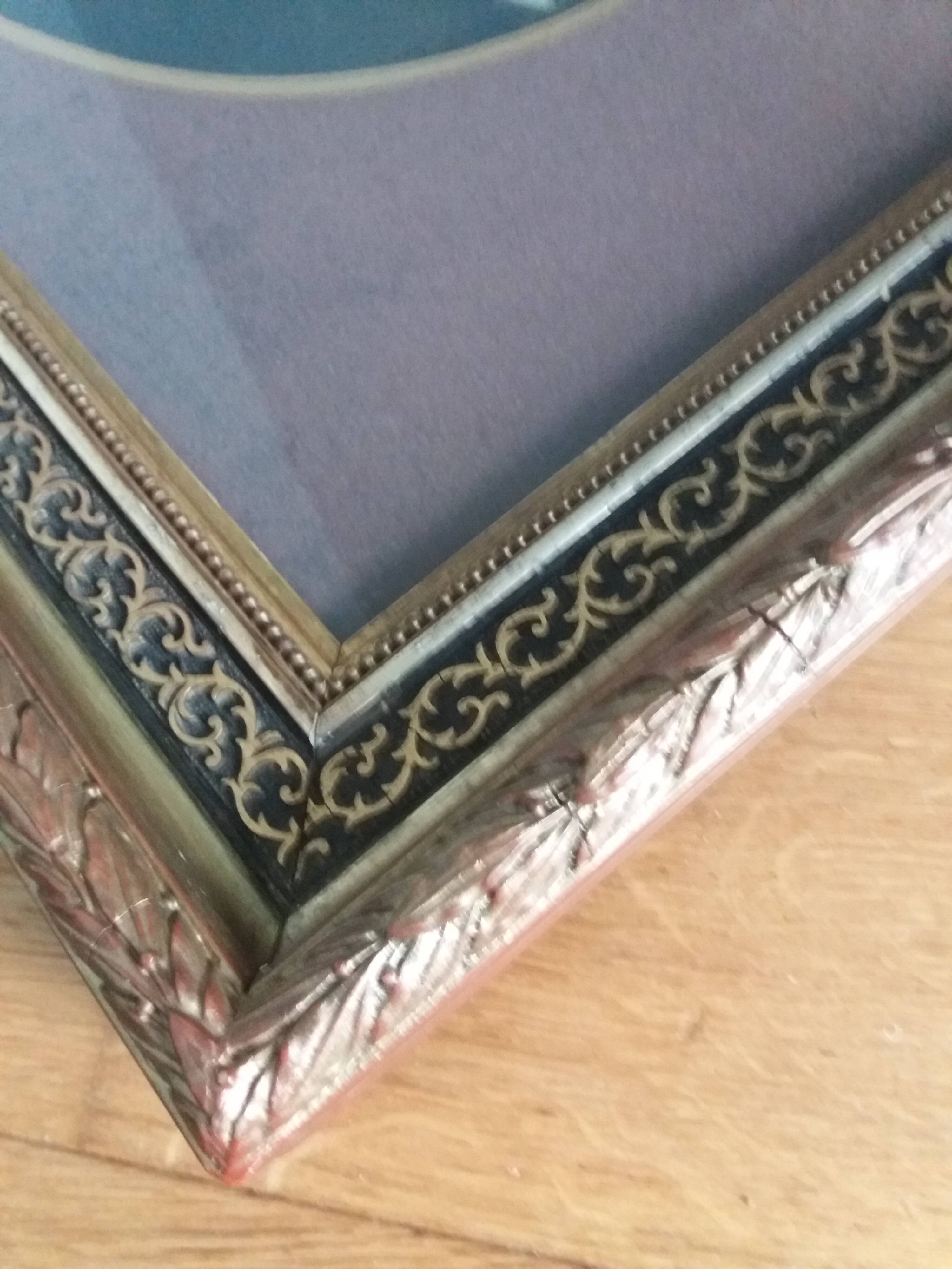 Old photo portrait framed in wood and stucco