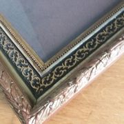 Old photo portrait framed in wood and stucco