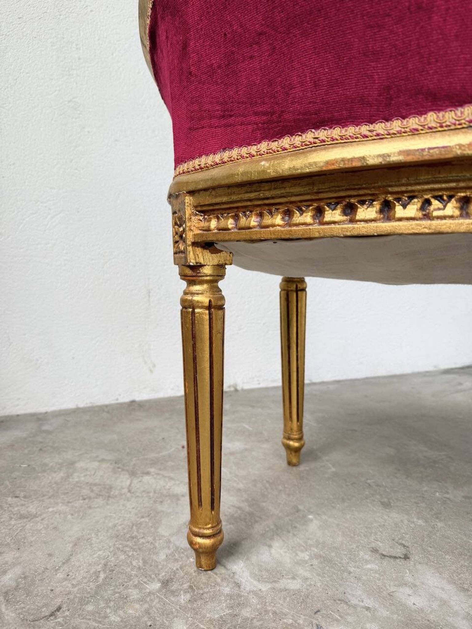 Louis XVI gilt wood and red velvet armchair
