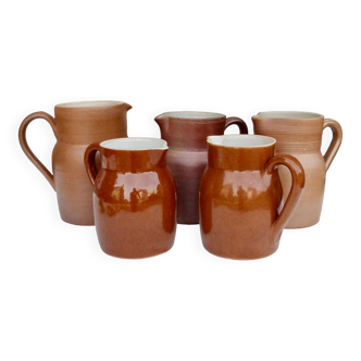 Set of 5 brown stoneware jugs