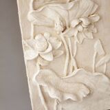 Bas-relief with flowers. Relief with flowers. Flowers in relief.