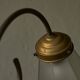 Sculptural table lamp in brass and opaline glass, early 20th century.