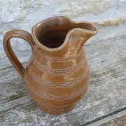 Old stoneware wine jug with patterns