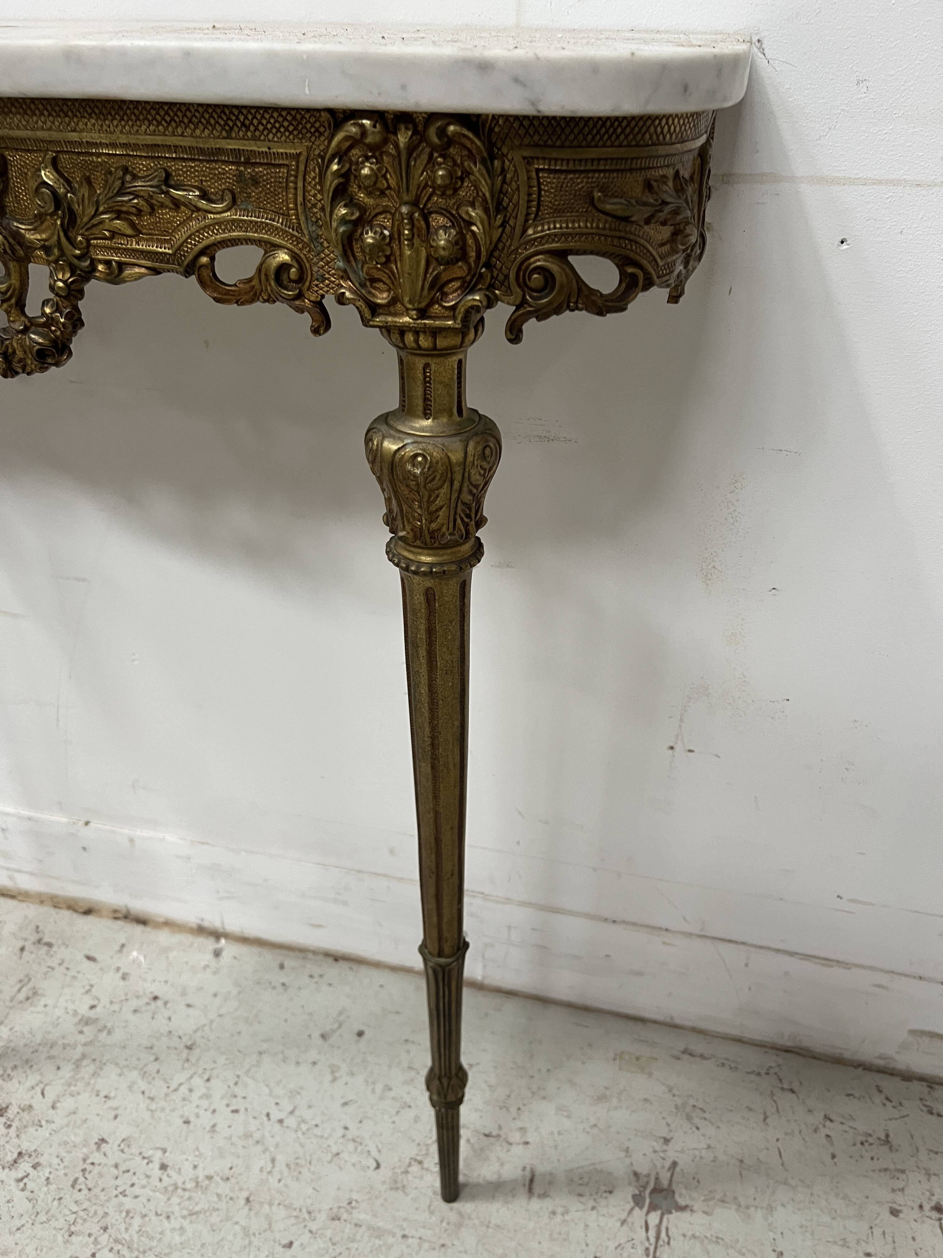 Louis XVI style console in chiselled bronze, 20th century.