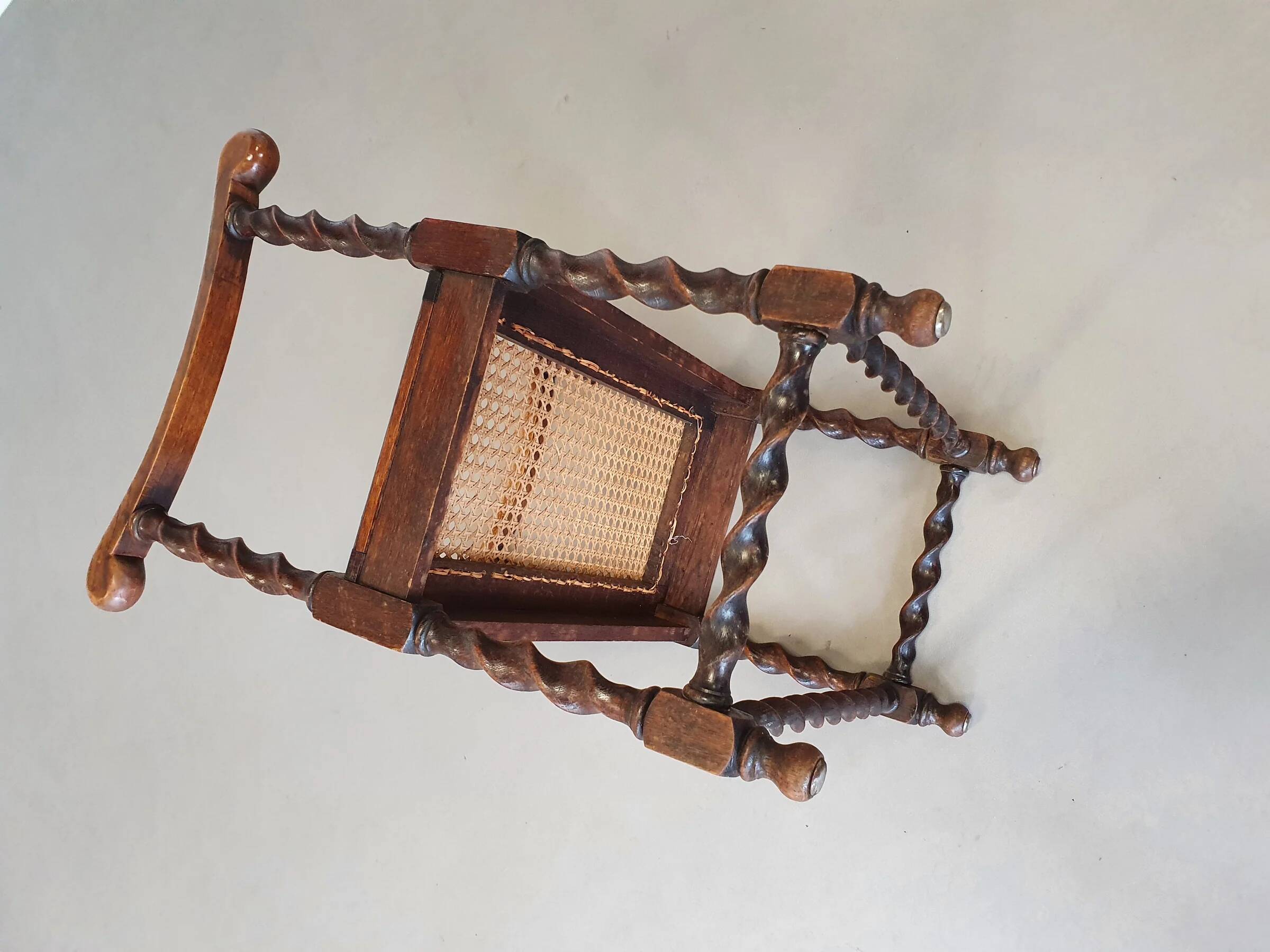 Wokkel chair with armrests and webbing seat