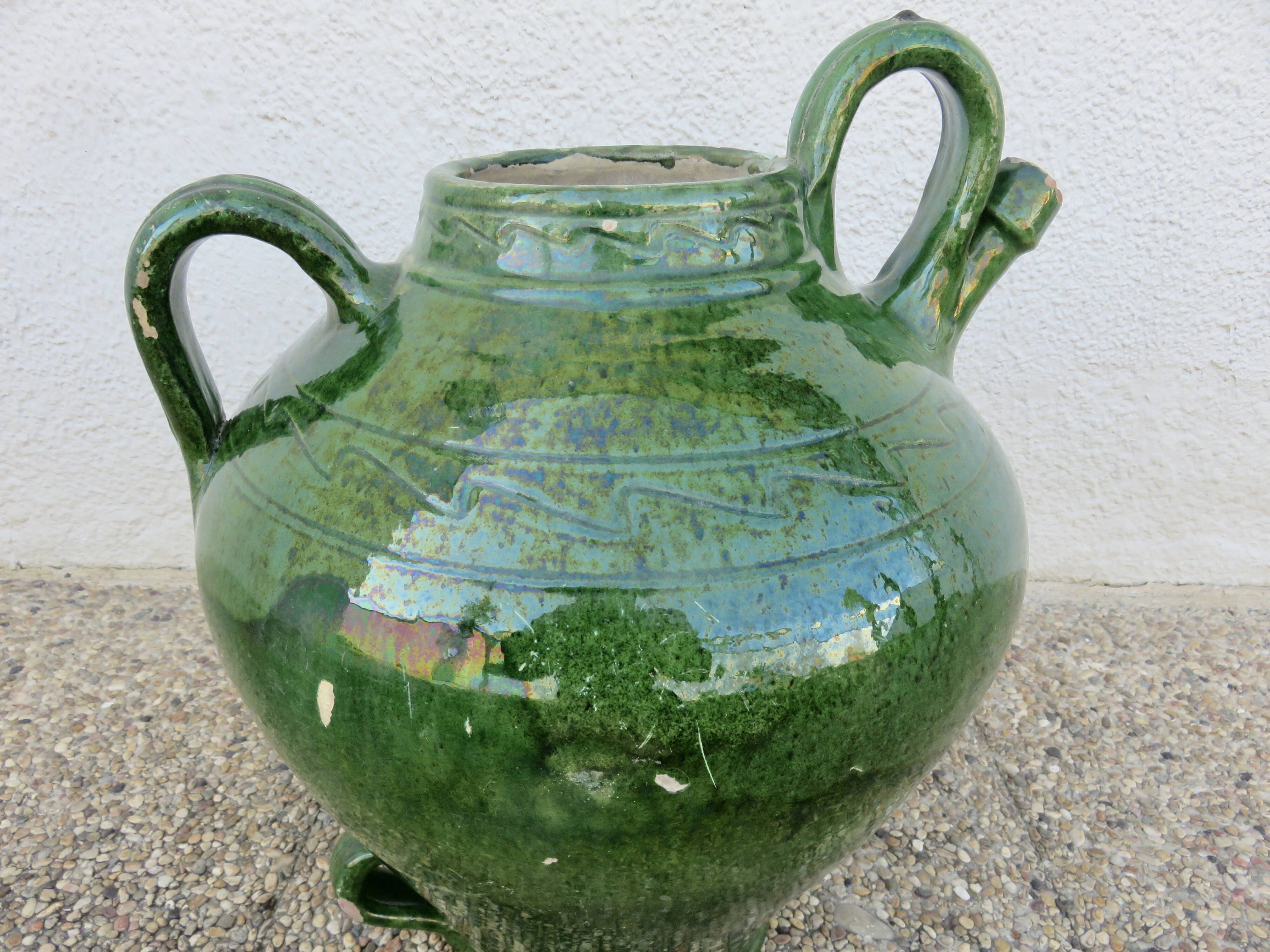 Antique glazed green terracotta oil jar, late 19th century.