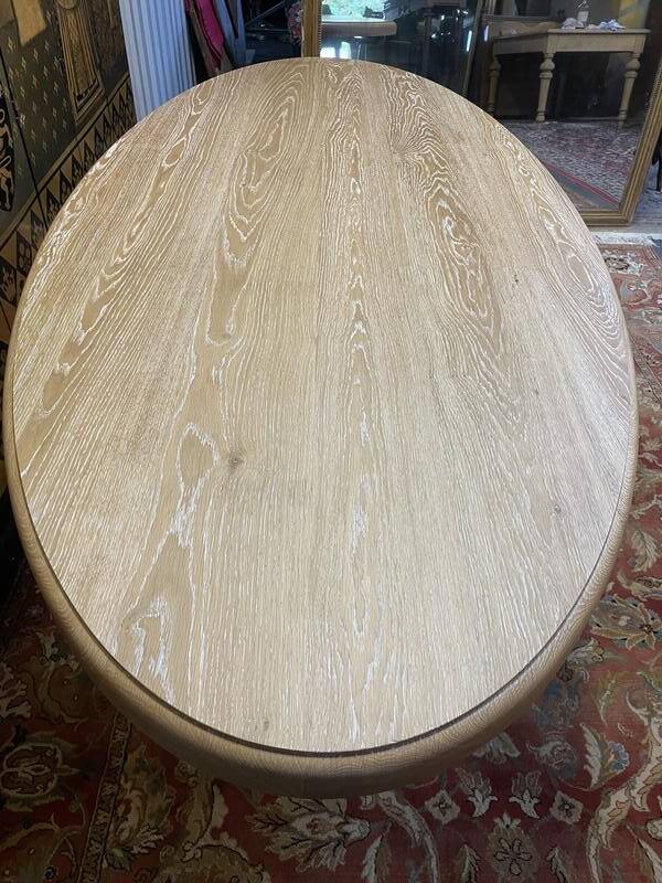 Oval oak dining table with vase legs
