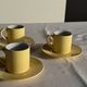 Set of 4 vintage yellow Italian espresso cups and saucers.