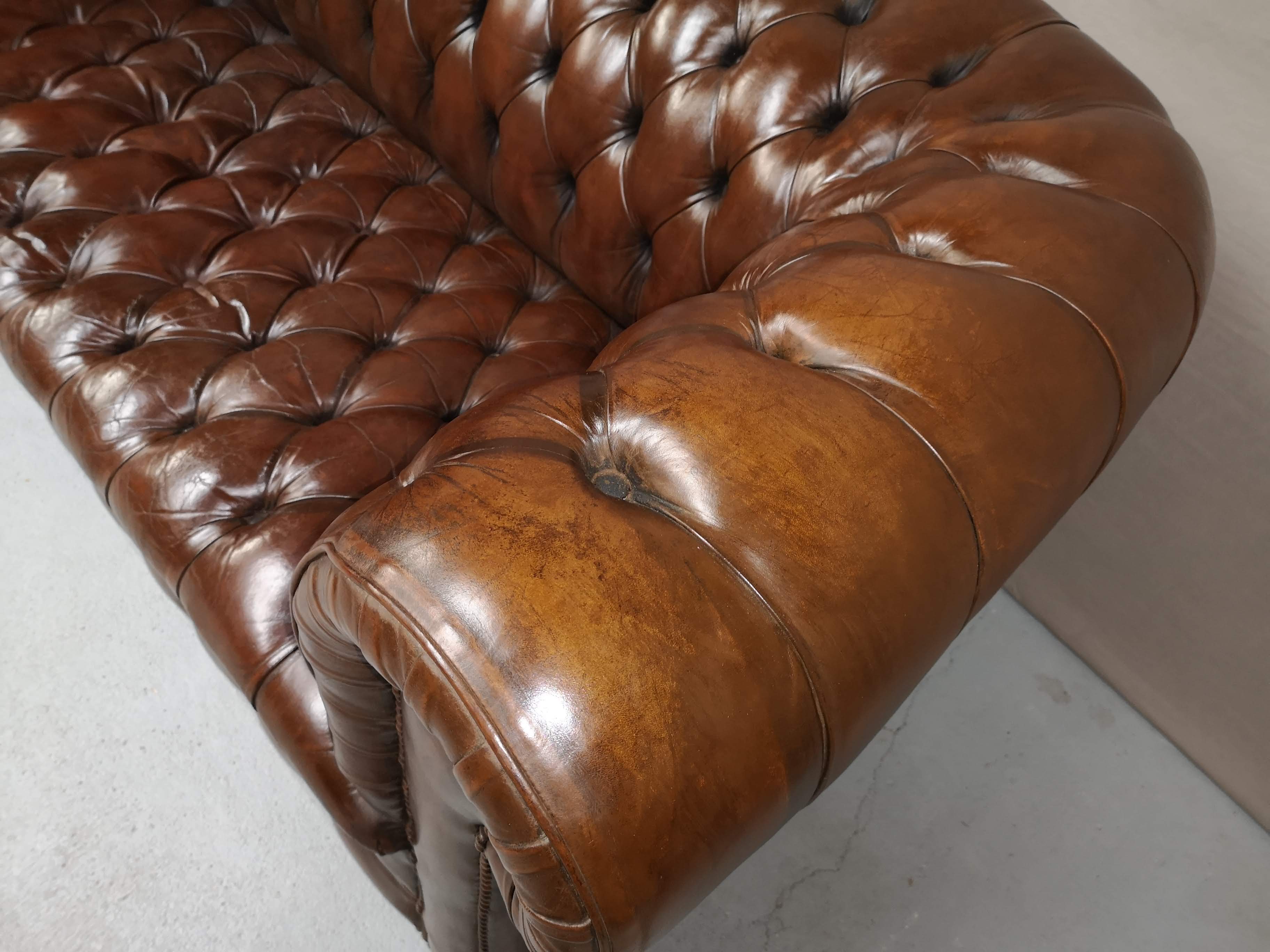 Upholstered chesterfield brown sofa