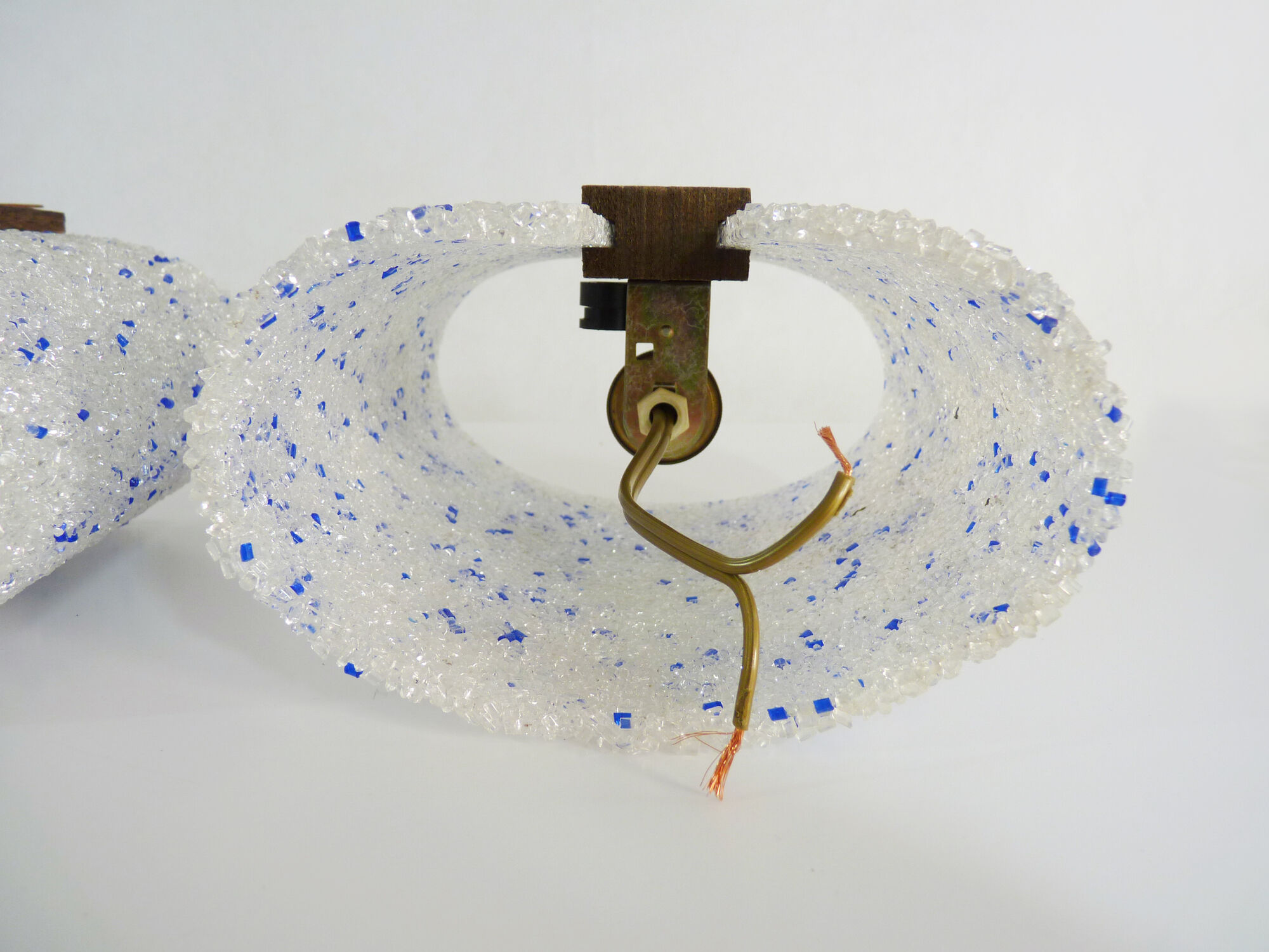 Pair of vintage wall sconces in transparent and wavy blue perspex. Year 60