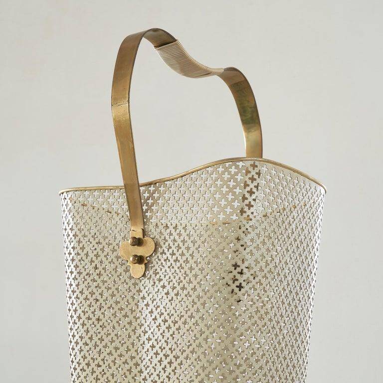 Mid-century umbrella stand in patinated brass and perforated metal, 1950s.