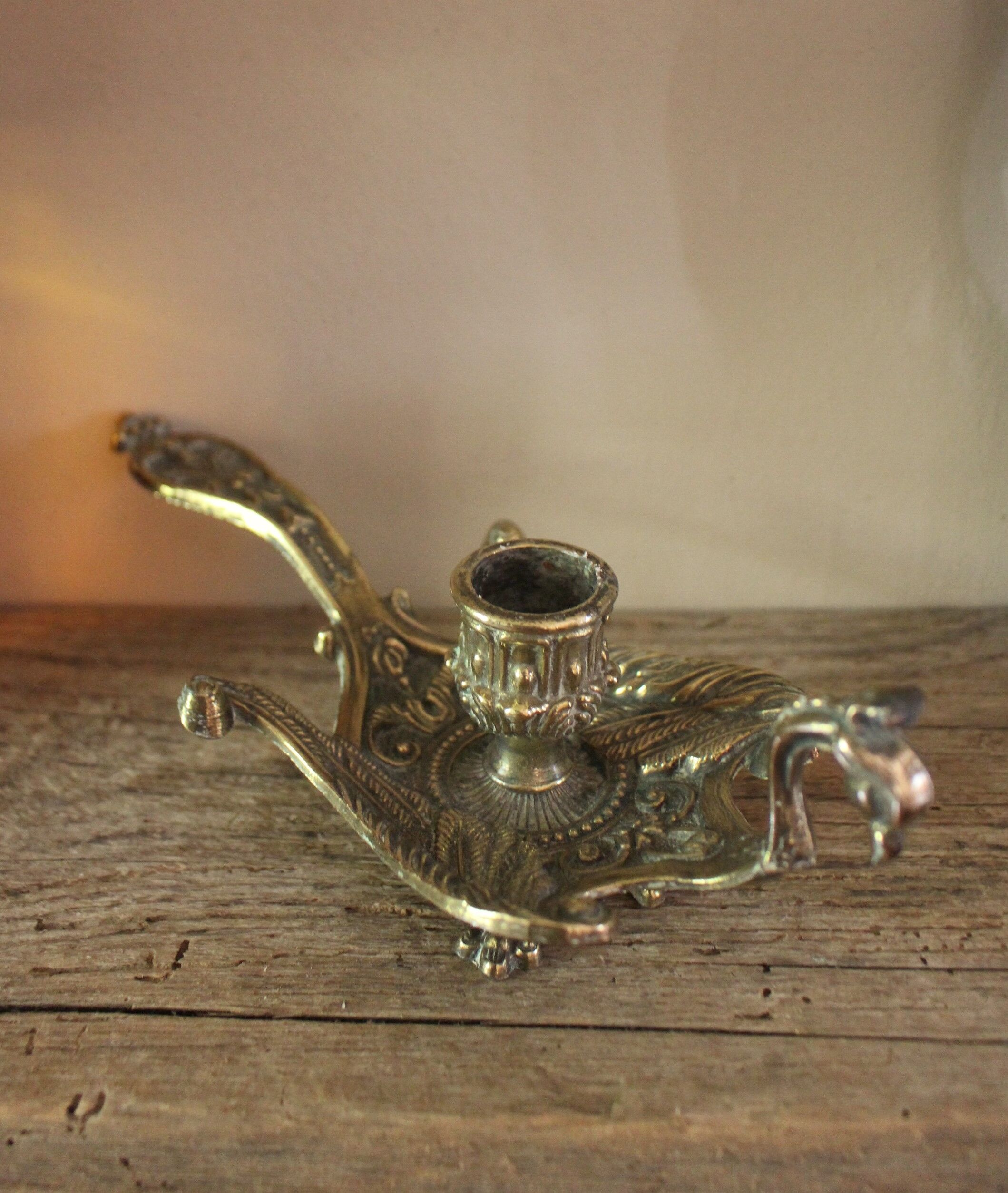 Brass candle holder cave rat peacock