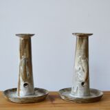 Duo of sandstone candlesticks