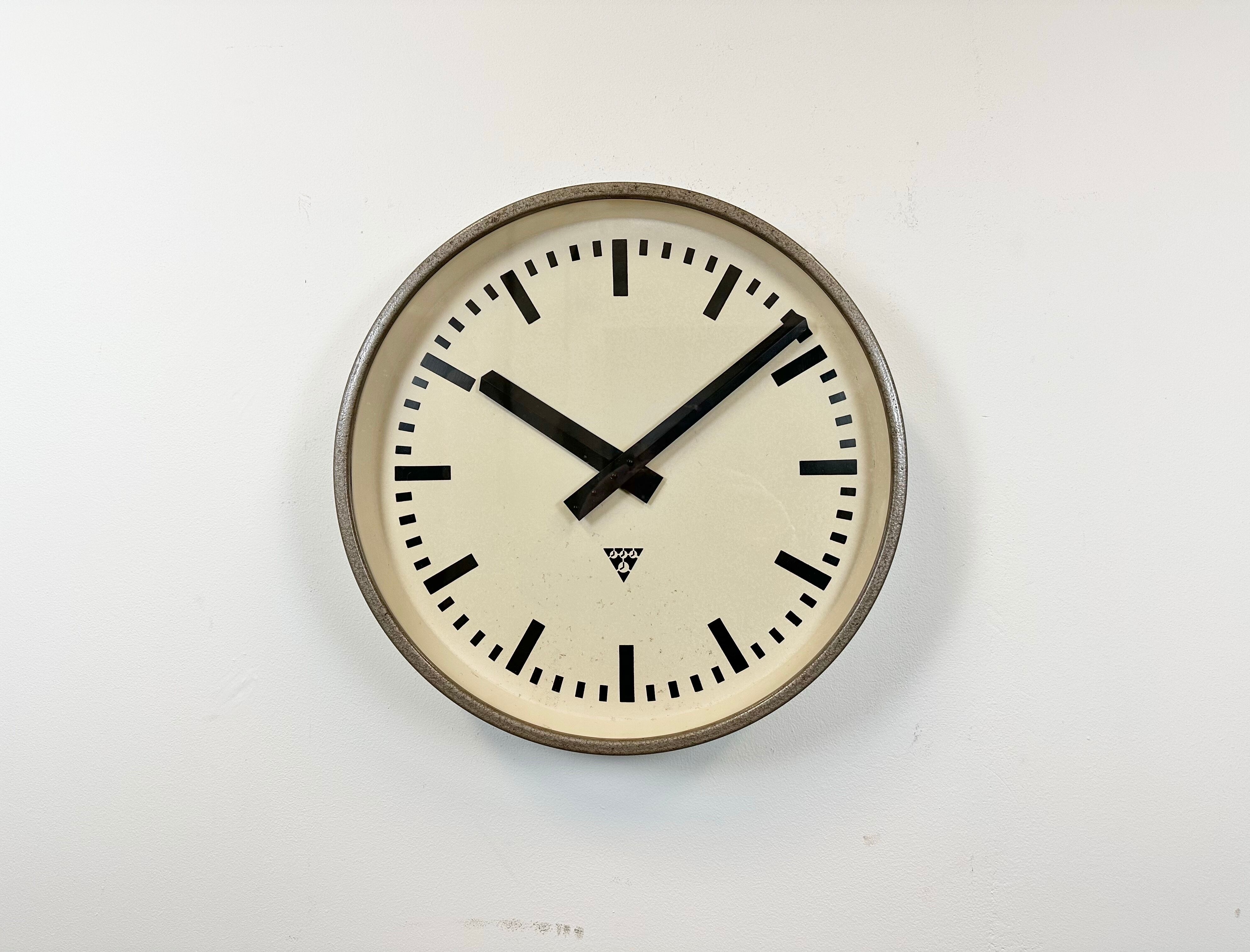 Brown industrial factory wall clock from Pragotron, 1960s