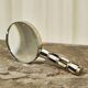 Art Deco magnifying glass in mother-of-pearl and silver, 1930.