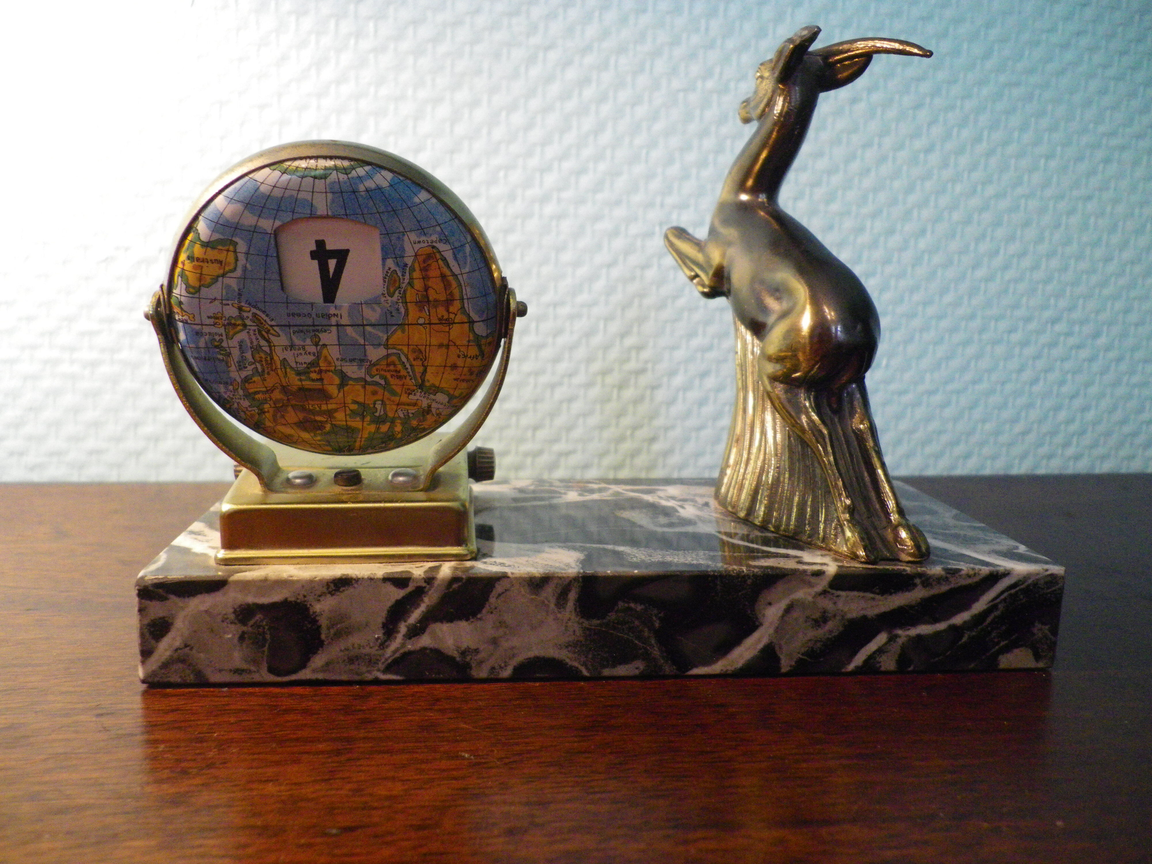 Perpetual calendar on marble base with marble patinated regulated decoration, 60s
