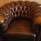 Chesterfield club armchair in patinated chestnut coloured leather