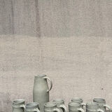 Set in stoneware cups and pitcher