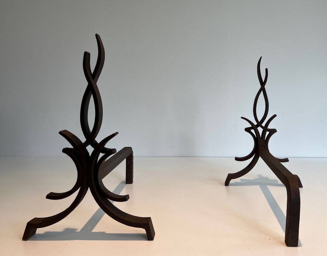 Pair of Wrought Iron Andirons with Stylised Flamboyant Uprights and Enrobed Feet