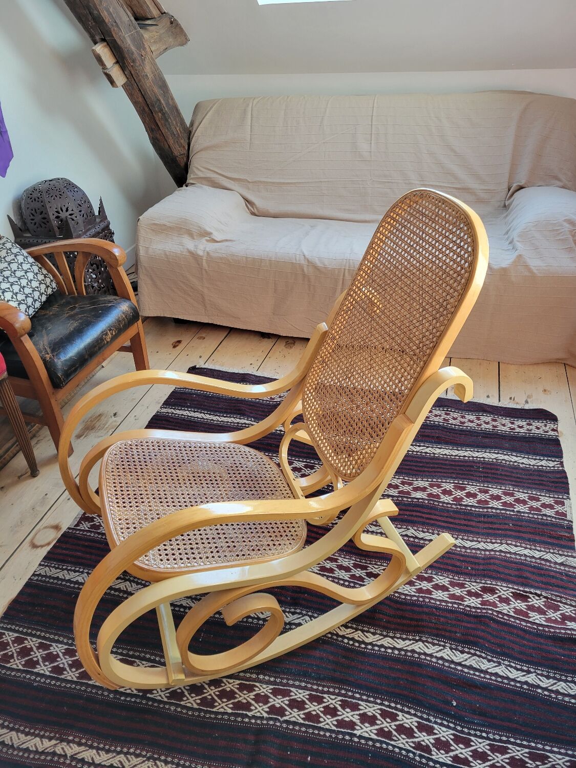 Rocking chair in arched wood and cane