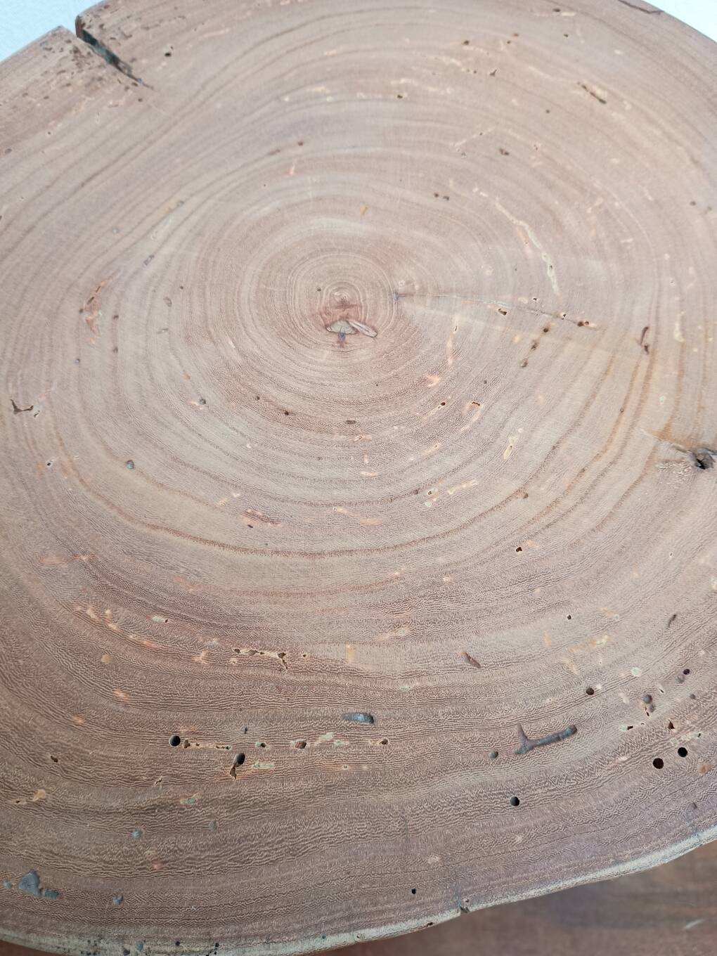 Brutalist tripod coffee table in solid wood.