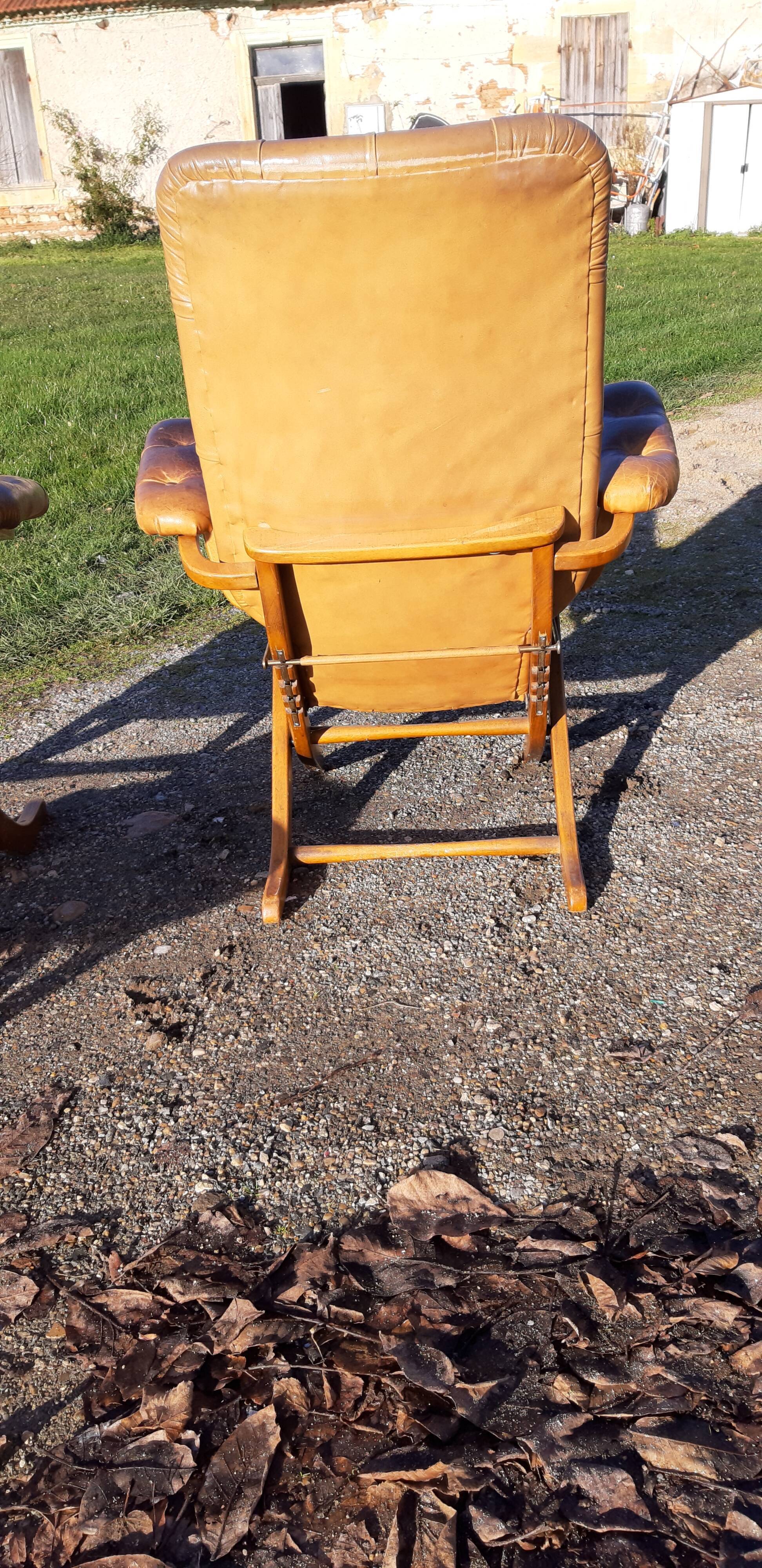 Pair of chesterfield style leather armchairs