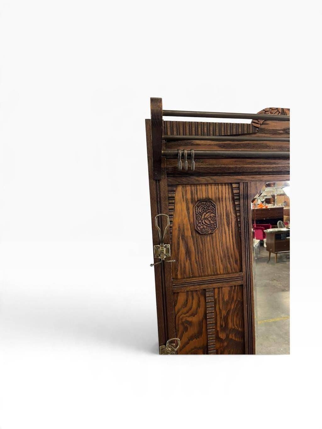 Vintage wooden coat rack with mirror.