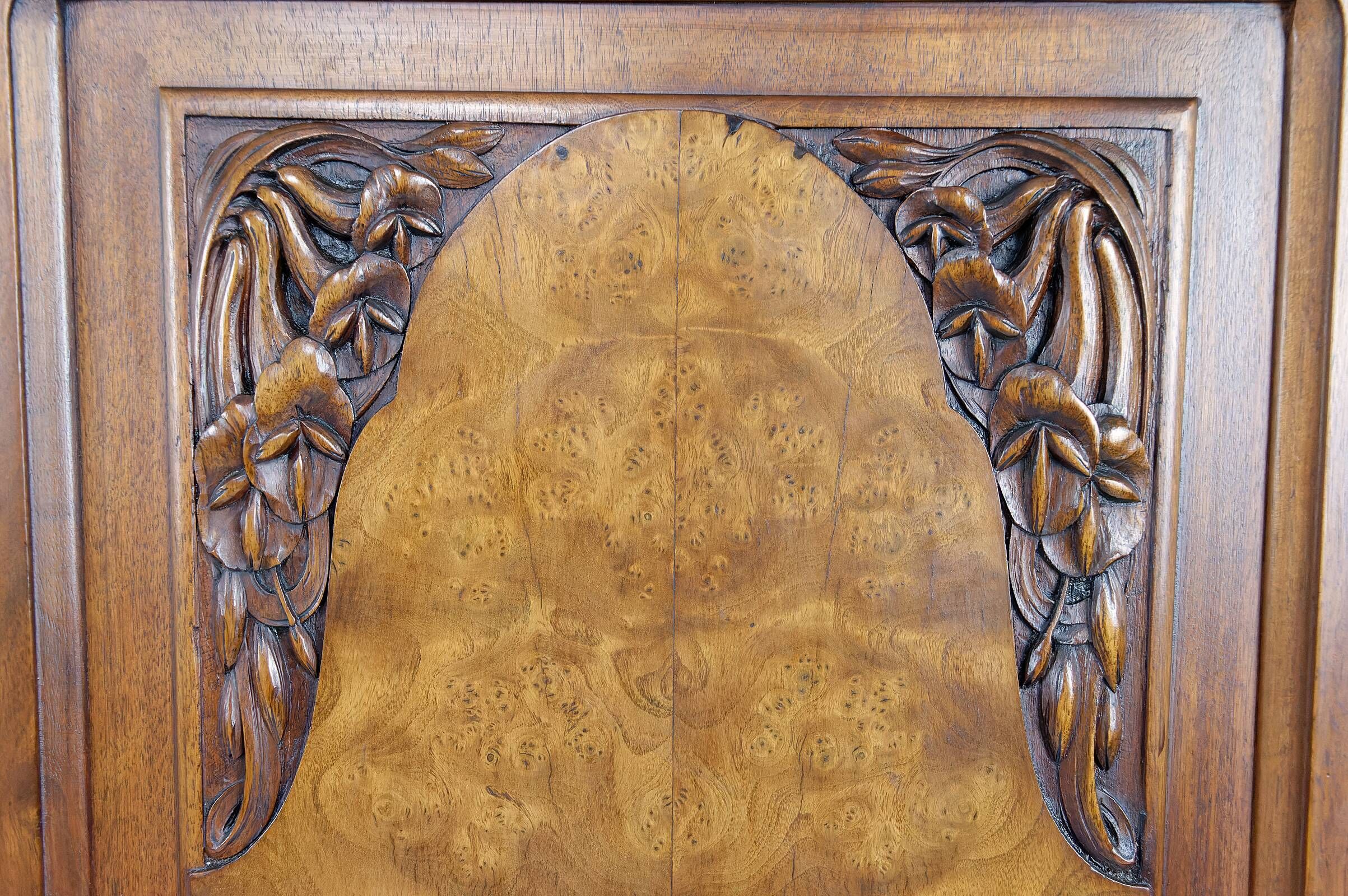 Art Deco showcase bookcase in carved walnut, France, circa 1925