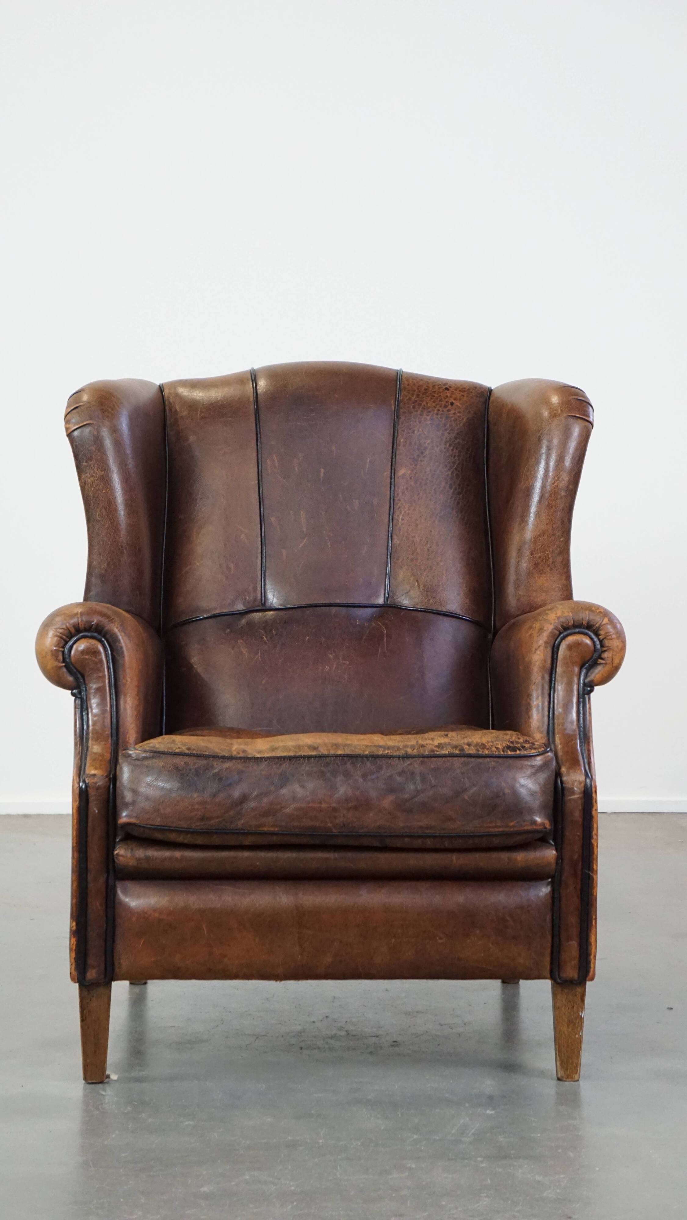 Sheep leather wing chair with patina