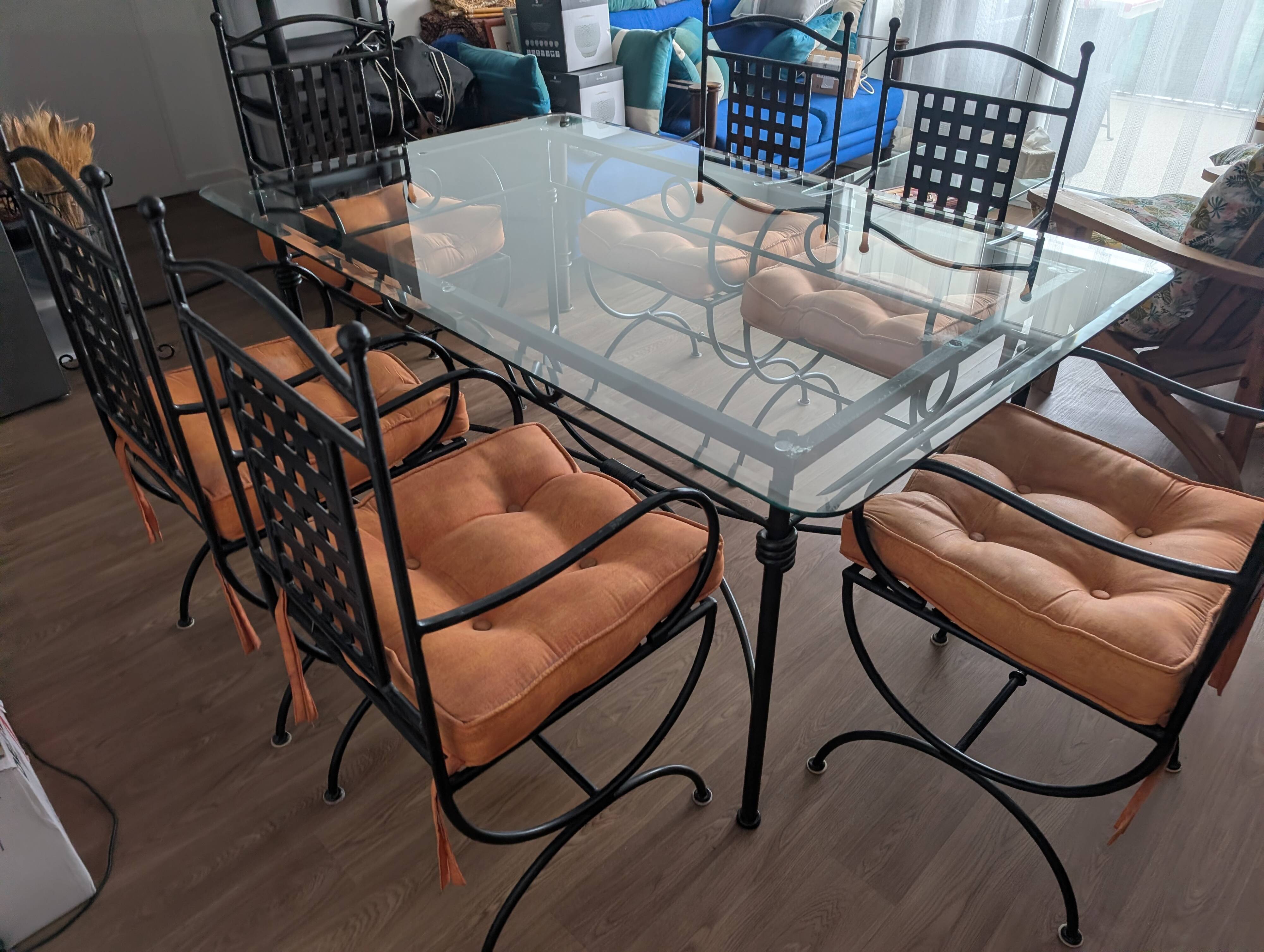 Wrought iron table made in Mexico and 6 chairs.