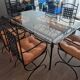 Wrought iron table made in Mexico and 6 chairs.