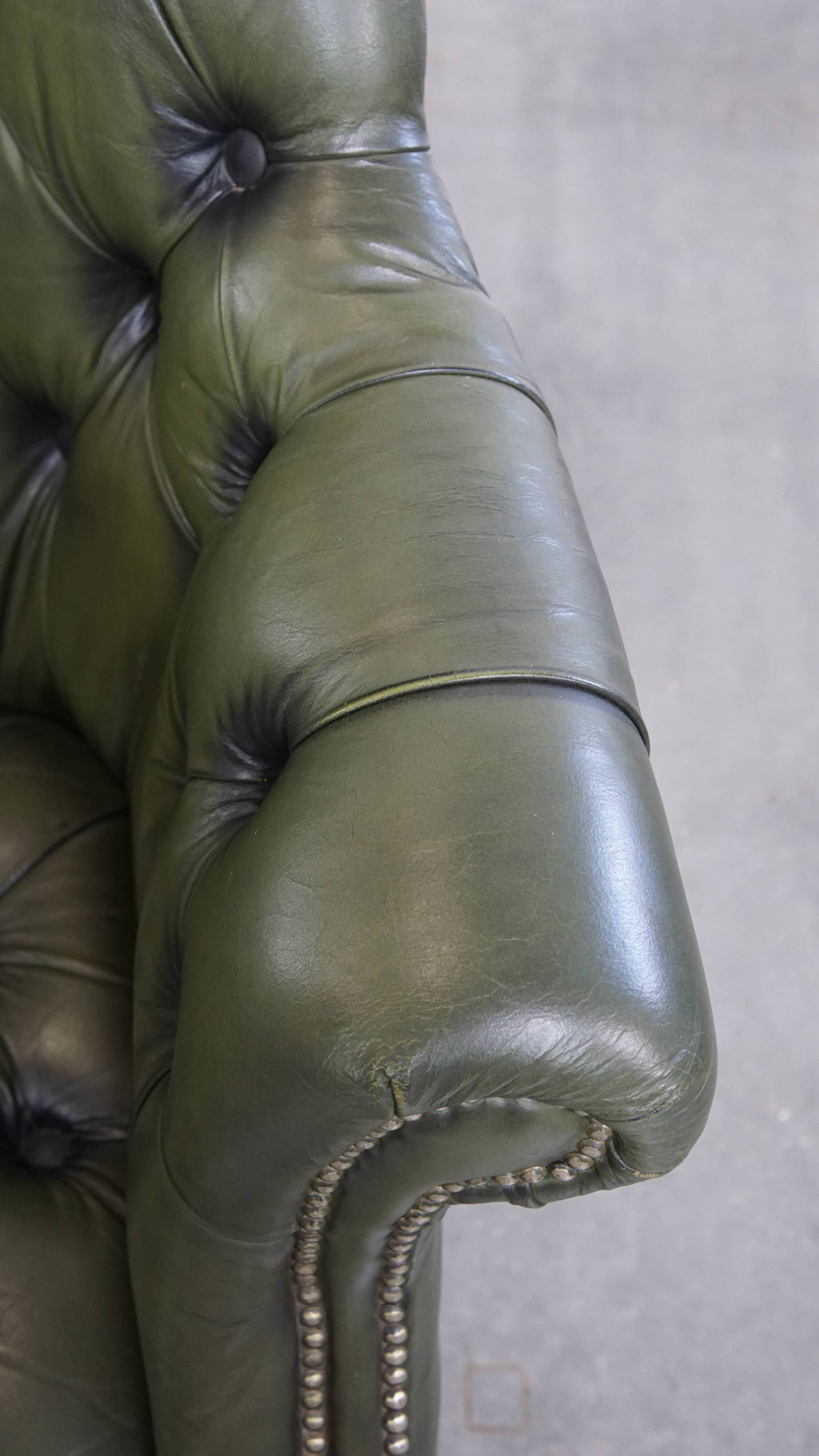 Chesterfield office chair in green cowhide leather on casters with high back