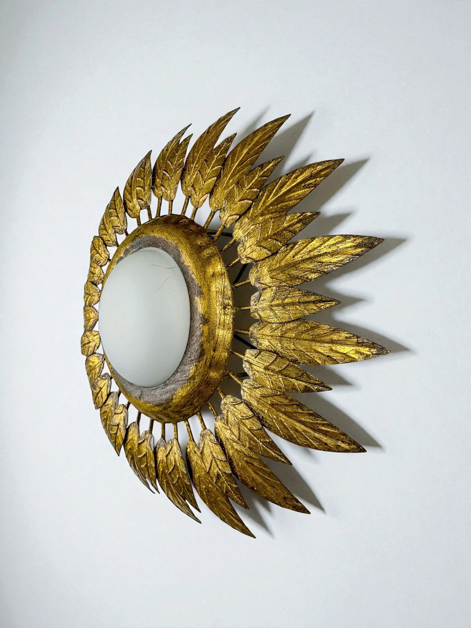 Spanish sunburst ceiling light – opaline glass & gilt iron foliage, 1960s