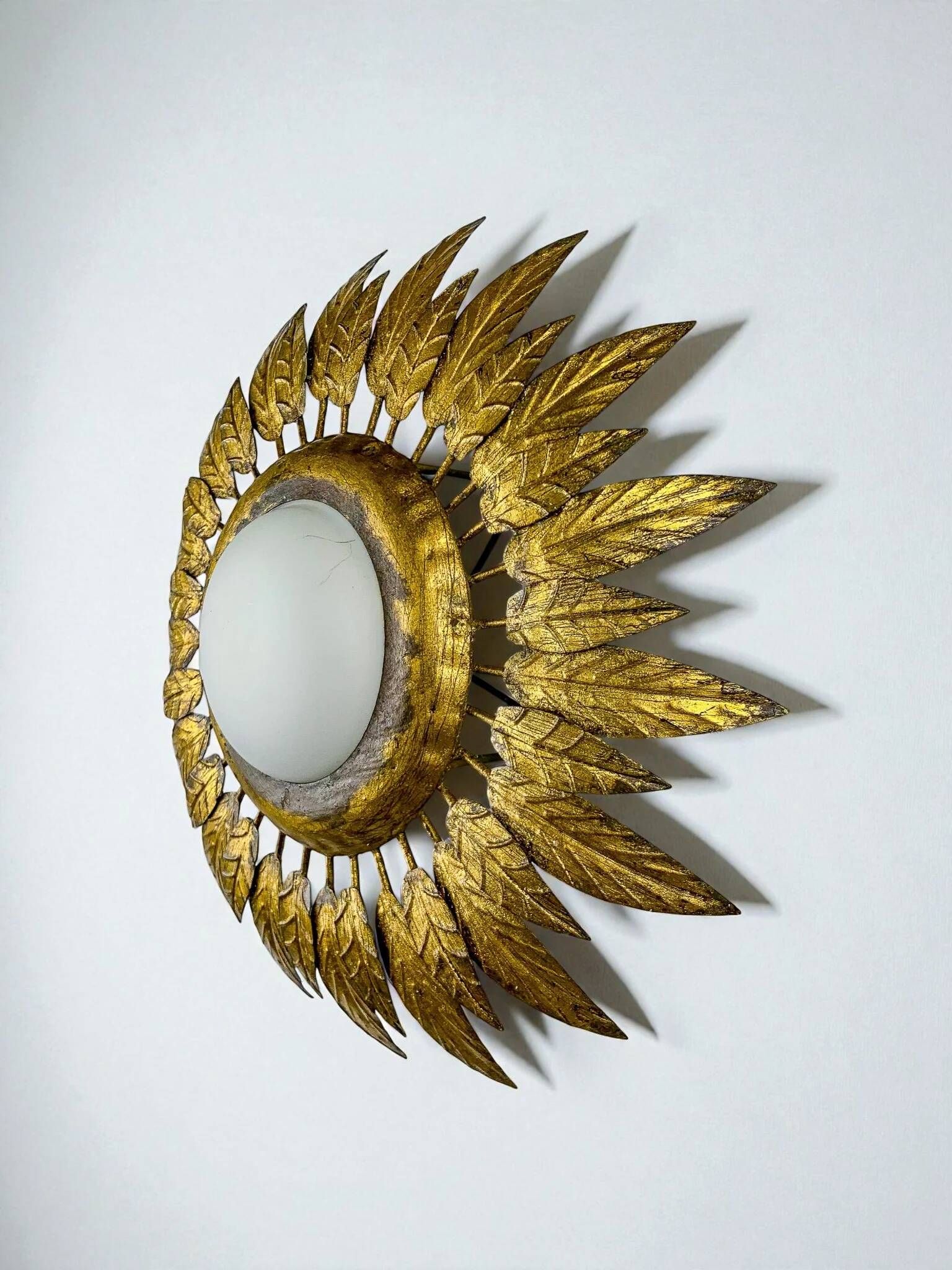 Spanish sunburst ceiling light – opaline glass & gilt iron foliage, 1960s