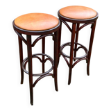 Pair of curved wooden bistro stools with leather seats