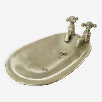 Old art deco soap dish in the shape of a bronze bathtub from the 30s 40s
