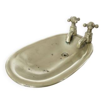 Old art deco soap dish in the shape of a bronze bathtub from the 30s 40s