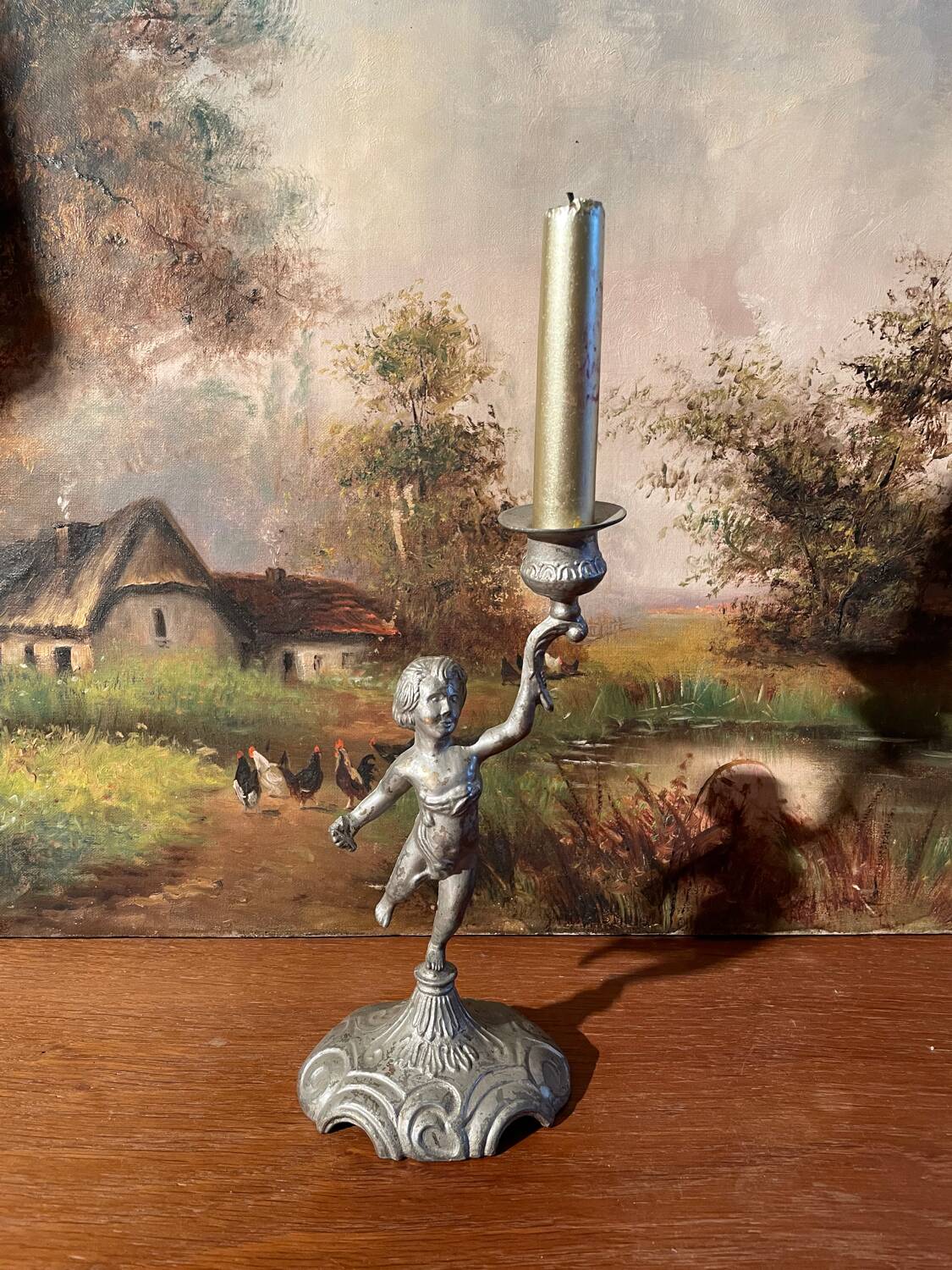 Old cherub candle holder