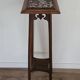 High plant stand in carved wood and Art Nouveau marble.