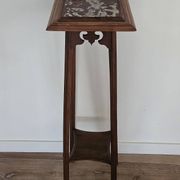 High plant stand in carved wood and Art Nouveau marble.