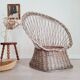 Antique armchair in gray woven wicker
