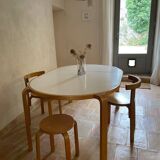 Attractive designer set: table, chairs and stool