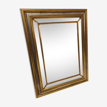 Mirror in gold and silver color